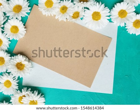 card mockup with flowers , Bluish green background