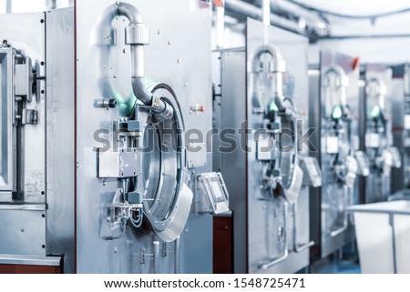 Industrial wash machine for washing a big amount of textiles Royalty-Free Stock Photo #1548725471