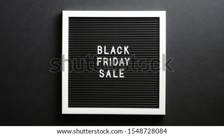 Black friday sale sign on letter board over black background
