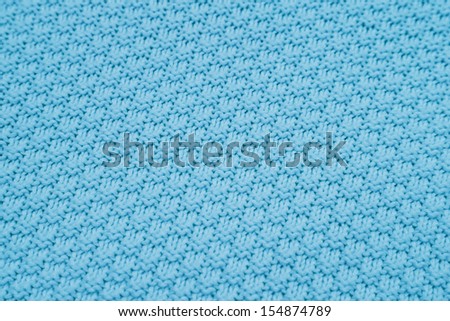 background of seamless pattern of  blue knitted wool