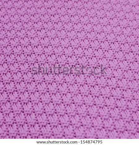 background of seamless pattern of  purple knitted wool