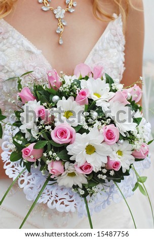 The bride holding a bouquet close up