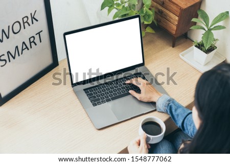 mockup image blank screen computer with white background for advertising text,hand man using laptop texting contact business search information on desk in office.marketing and creative design