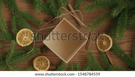 Top view open empty brown gift box on ash surface with christmas decorations