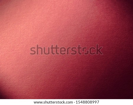 the photo of red paper under sunlight. the gradient color of red and purple tone.