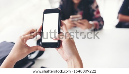 Person typing something on smartphone with empty white screen. Mobile app technology communication, wireless, internet of things concept.