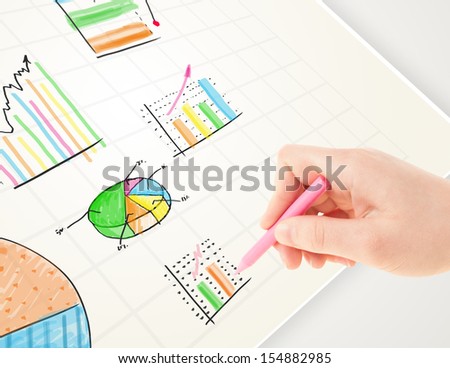 Business person drawing colorful graphs and icons on plain paper