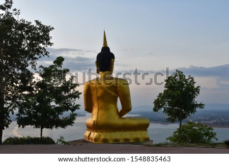 Big buddha statue sunset in laos. 