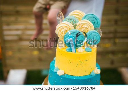 beautiful birthday cake in yellow and blue for one year old	