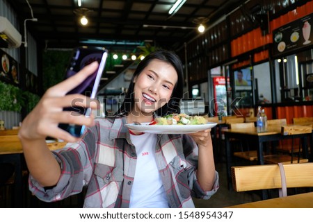 Asian travelling girl selfie with Thai food, Photographer Travel Sightseeing Wander Hobby Recreation Concept.