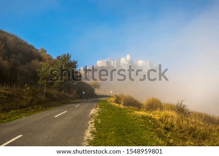 The old castle disappears in the fog