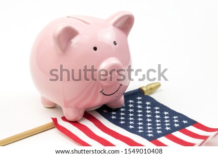 Piggy bank isolated against the background of the american flag. View from above.