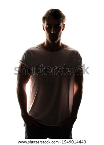 Portrait of strong caucasian white man with incognito shadow face on white isolated background. Color silhouette concept.
