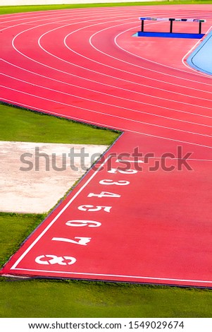 ATHLETICS TRACK WITH NUMBERED STREETS. SPORTS PHOTOGRAPHY