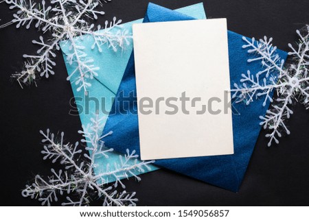 card mockup invitation. snowflakes on black background with silver tree balls and glitter stars. Christmas. new year 