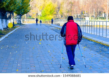 Finnish or Scandinavian walking in the Park 