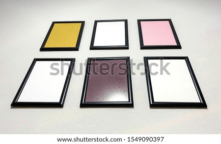 Blank vintage picture frame on wall background