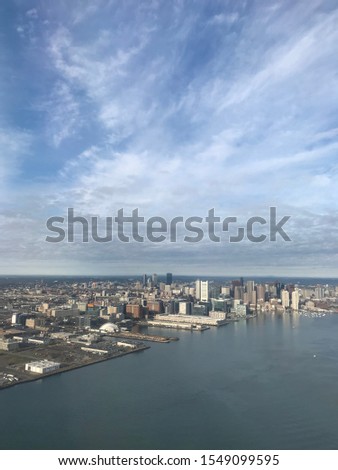 Ariel view of the city of Boston and the ocean from a plane window 