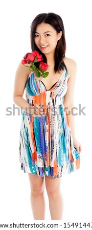 Attractive asian girl in her twenties isolated on a plein background shot in a studio