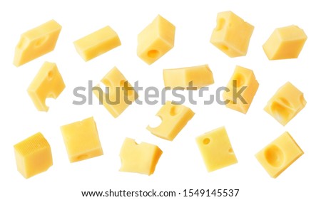 Hard cheese cubes fall isolated on white background
