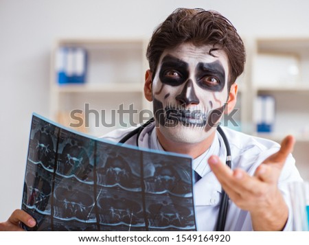 Scary monster doctor working in lab Royalty-Free Stock Photo #1549164920