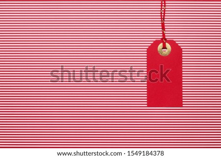 Red Sale tag on red background. Top view, copy space. Black friday concept.