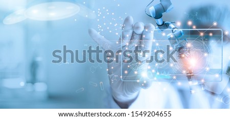 Doctor and medical assistant robot analysis and testing result of DNA on modern virtual interface, science and technology, innovative and future of medical healthcare in laboratory background.  Royalty-Free Stock Photo #1549204655