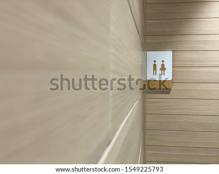 Sign board photo of male and female symbols for toilet