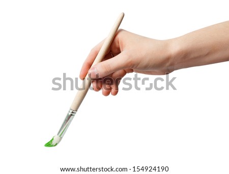 kid holds a paintbrush in hand