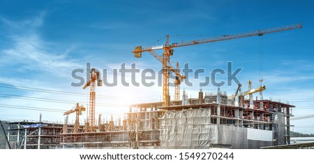 Panorama view at workers are working on large construction sites and many cranes are working in the, Industry new building business. Royalty-Free Stock Photo #1549270244