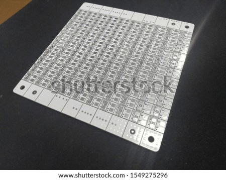 Multiplied printed circuit boards PCB isolated on the black background. PCB assembly.