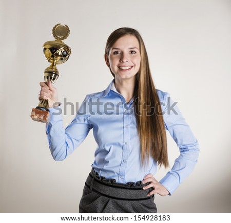 Successful business woman is posing in studio