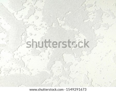 Fragment of a wall with Venetian plaster of delicate yellow color. Mine space and texture background. Front view.