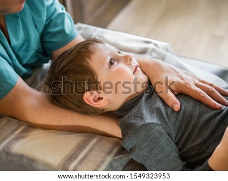 Real osteopath does physiological and emotional therapy for child. Osteopathy Treatment. Royalty-Free Stock Photo #1549323953