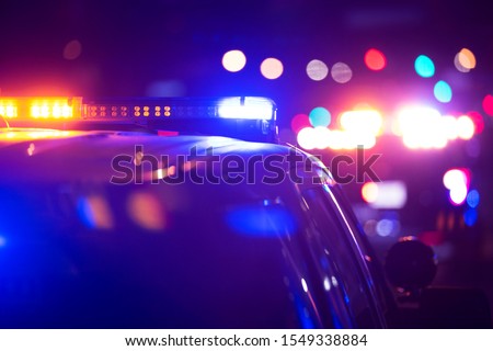 Police units responds to the scene of an emergency. Royalty-Free Stock Photo #1549338884