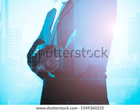 double exposure of businessman with the city