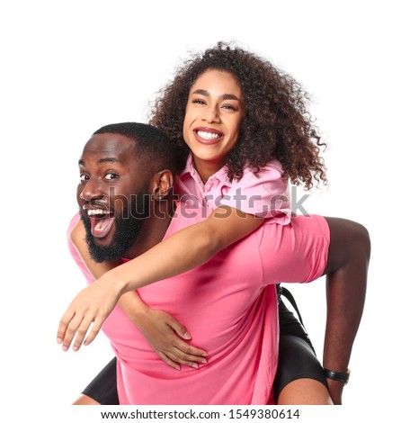 Portrait of happy African-American couple on white background