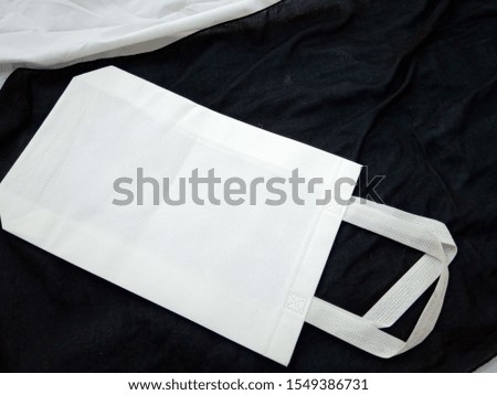 White ECO Bag, Box Type Non Woven Bag, Lying Bag on Black Background