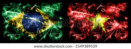 Brazil, Brazilian vs Vietnam, Vietnamese New Year celebration sparkling fireworks flags concept background. Combination of two states flags.
