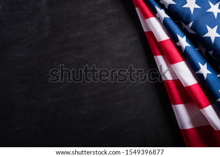 Happy Veterans Day. American flags veterans against a blackboard background.