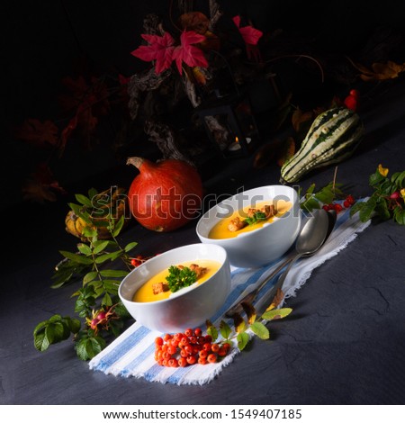 Delicious pumpkin soup with croutons and coconut milk