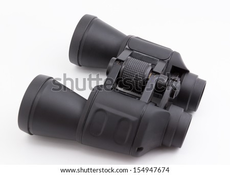 the black field glasses with are photographed on a white background