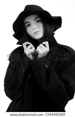 Fashion close-up portrait of young beautiful woman in hat.Black and white photo