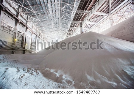 White heap pile of salt granules of phosphoric (phosphate) fertilizers on chemical plant