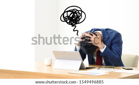 Frustrated asian businessman in office. Royalty-Free Stock Photo #1549496885