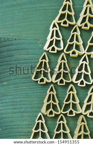 uncooked pine tree shape pasta on wooden table