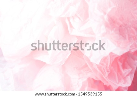 Pink crumpled paper for a wedding card. Crumpled pink paper texture.