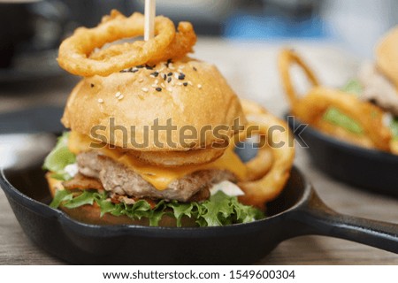 A big burger with grilled meat