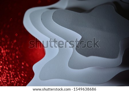 Curved shape paper cut onto the red foam sheet Sprinkled with reflective tips