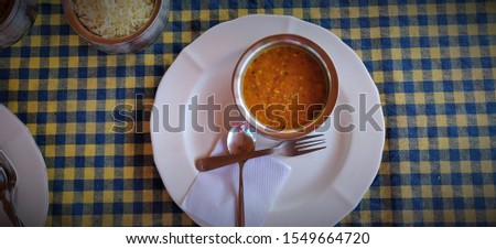 Stock photos, pictures and royalty-free images of Indian vegetable food served on table with spoon and fork